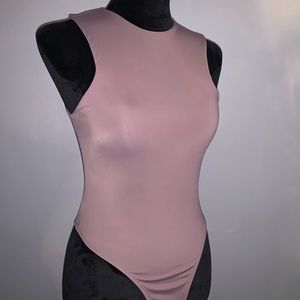 Form-fitting sleeveless bodysuit